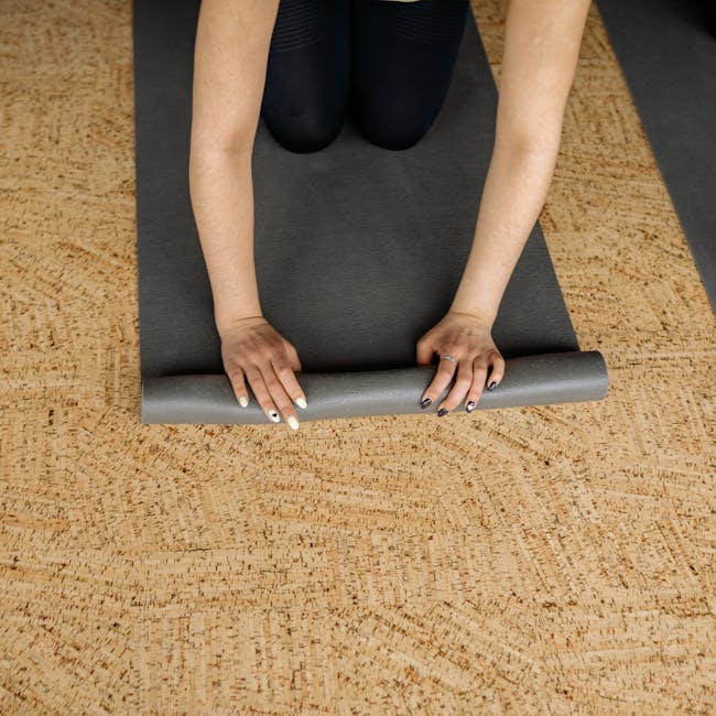 Manduka PRO yoga mat on a wood floor